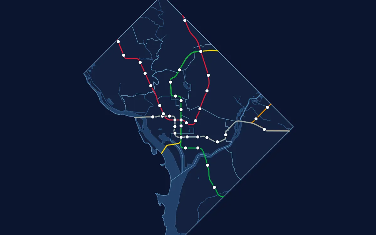 Dark map of Washington, DC showing Metro lines and stations over ward boundaries